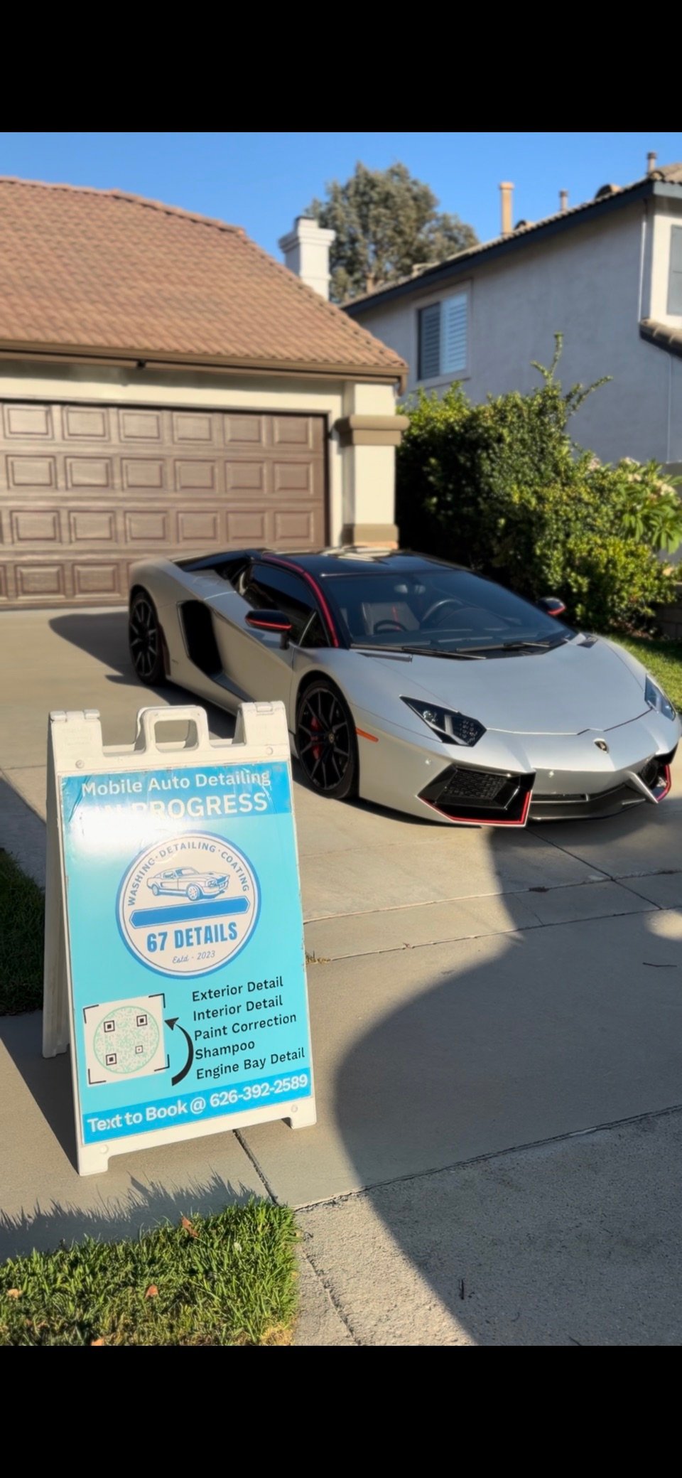 Lamborghini Aventador beside the 67 Details mobile detailing sign
