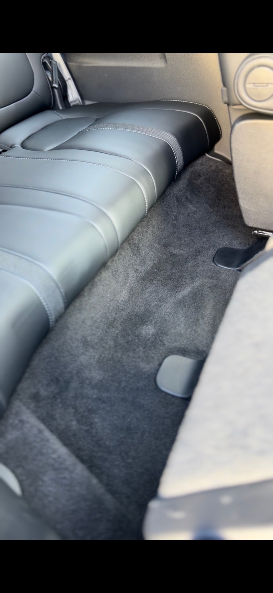 Clean rear passenger carpet after interior detailing