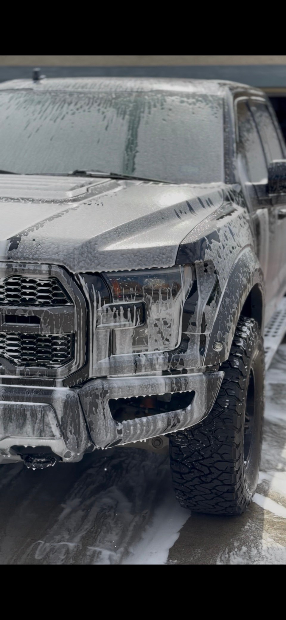 Ford pickup truck during a mobile foam wash