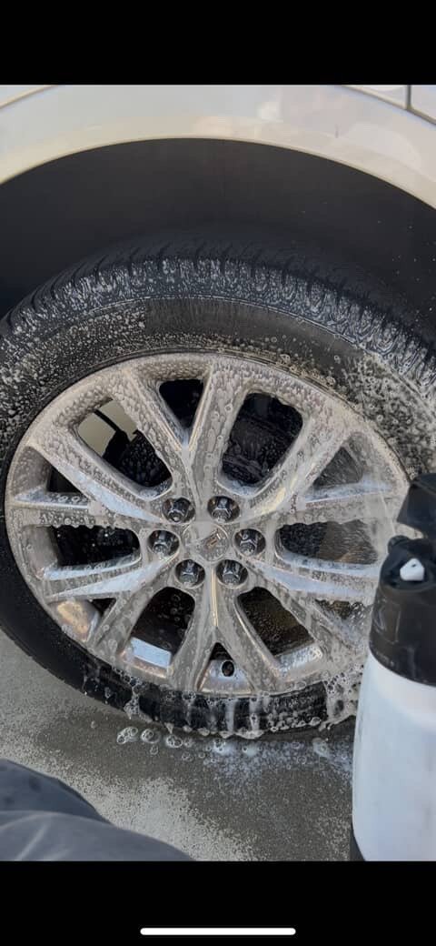 Wheel and tire covered with cleaning foam