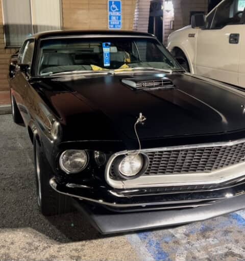 Black classic Ford Mustang after exterior detailing